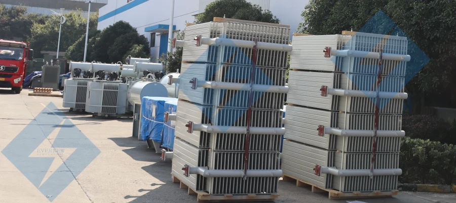 Oil-immersed neutral grounding transformer in production at Evernew factory, showing assembly line and industrial equipment.