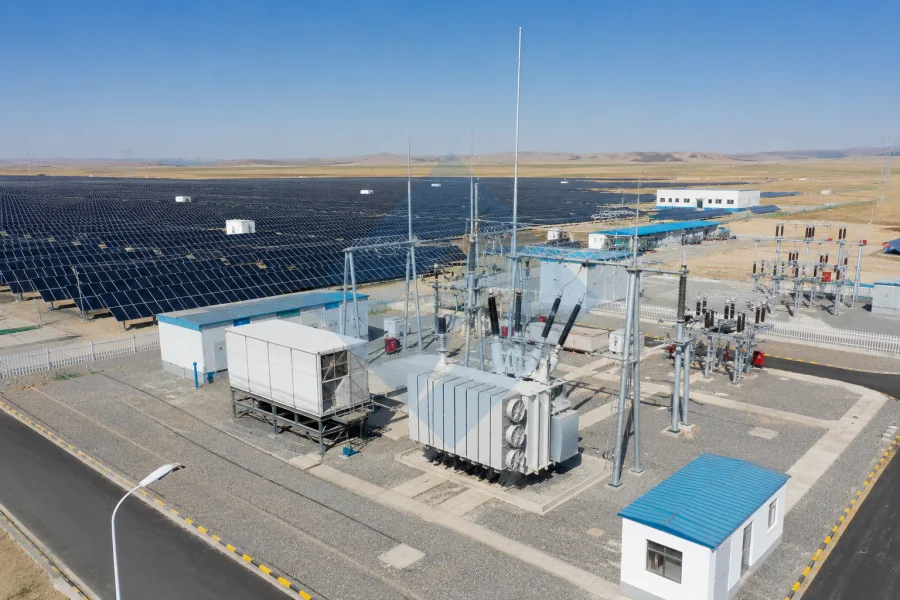 Solar farm step up transformer installed in a utility-scale photovoltaic power plant for renewable energy grid connection and high-voltage transmission by Evernew Transformer.